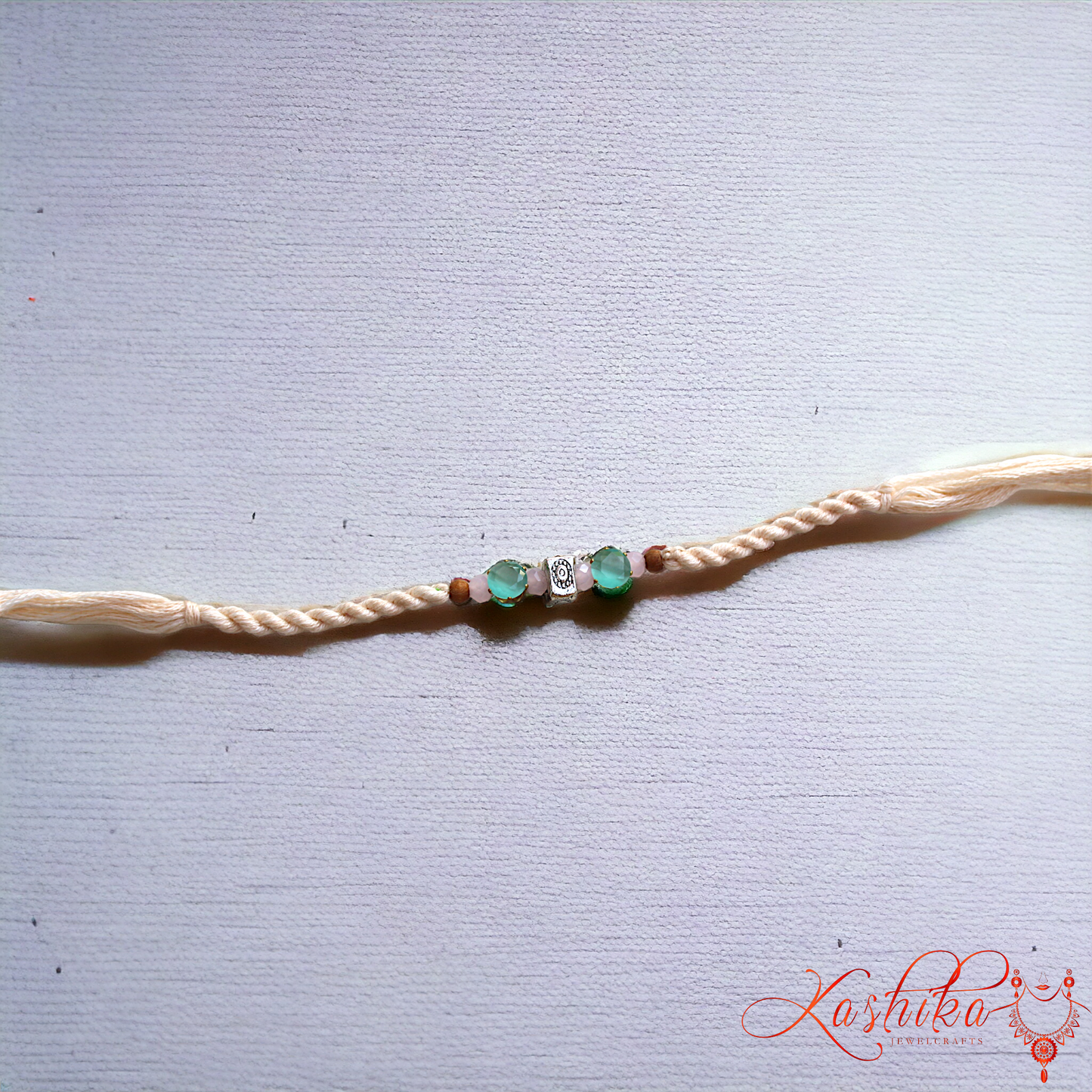 Peach Green Stone Thread Rakhi