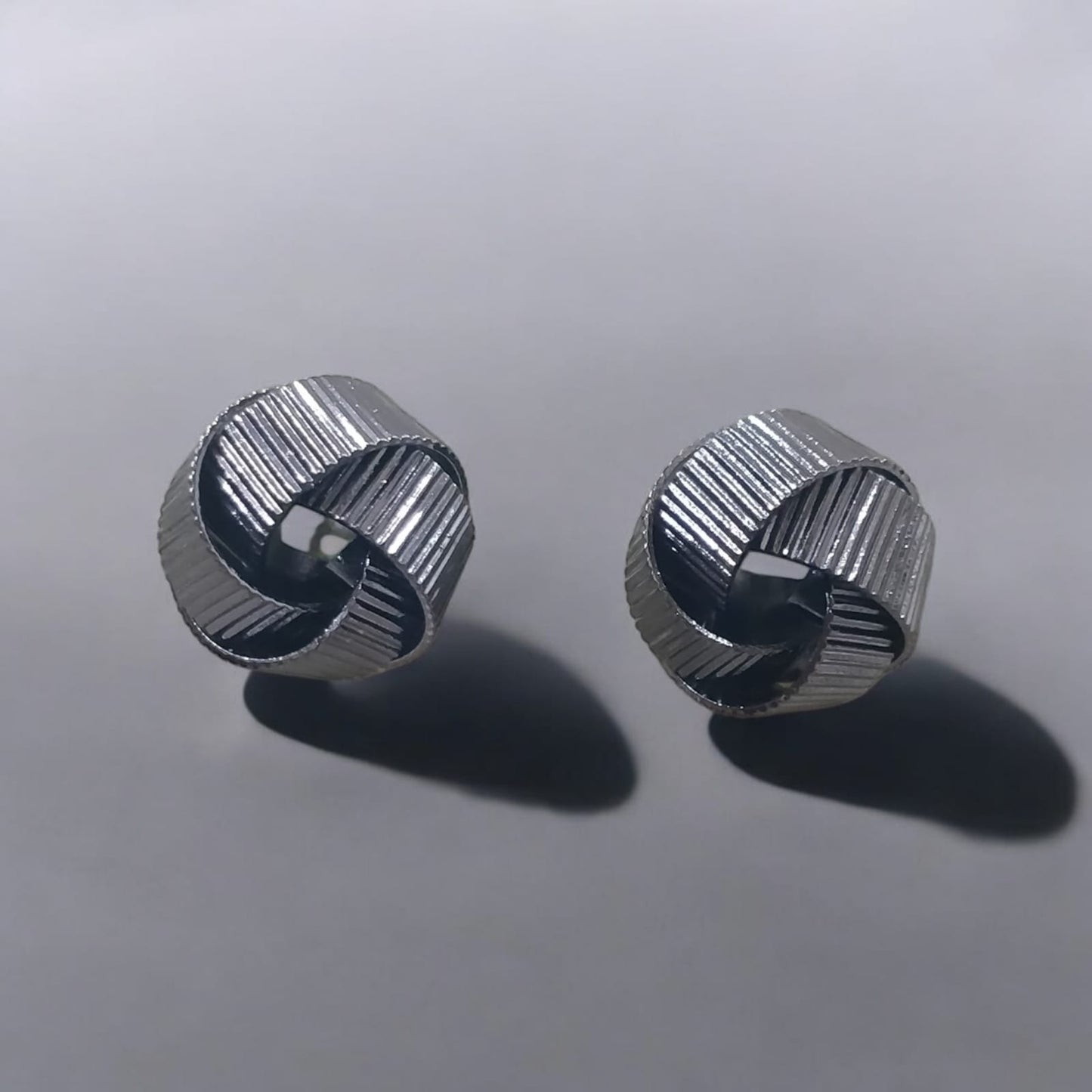 Textured metallic knot stud earrings