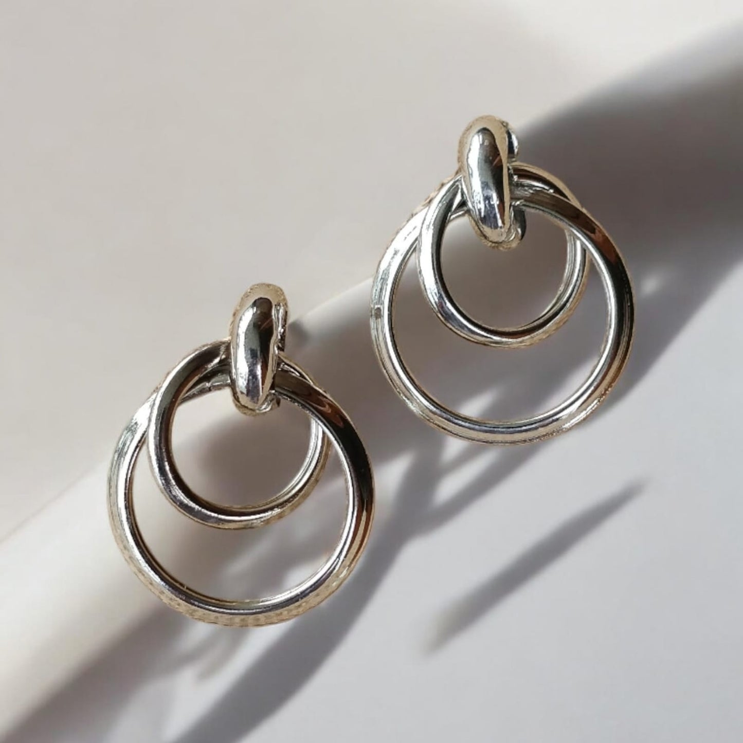 Sliver twisted hoop in hoop earrings