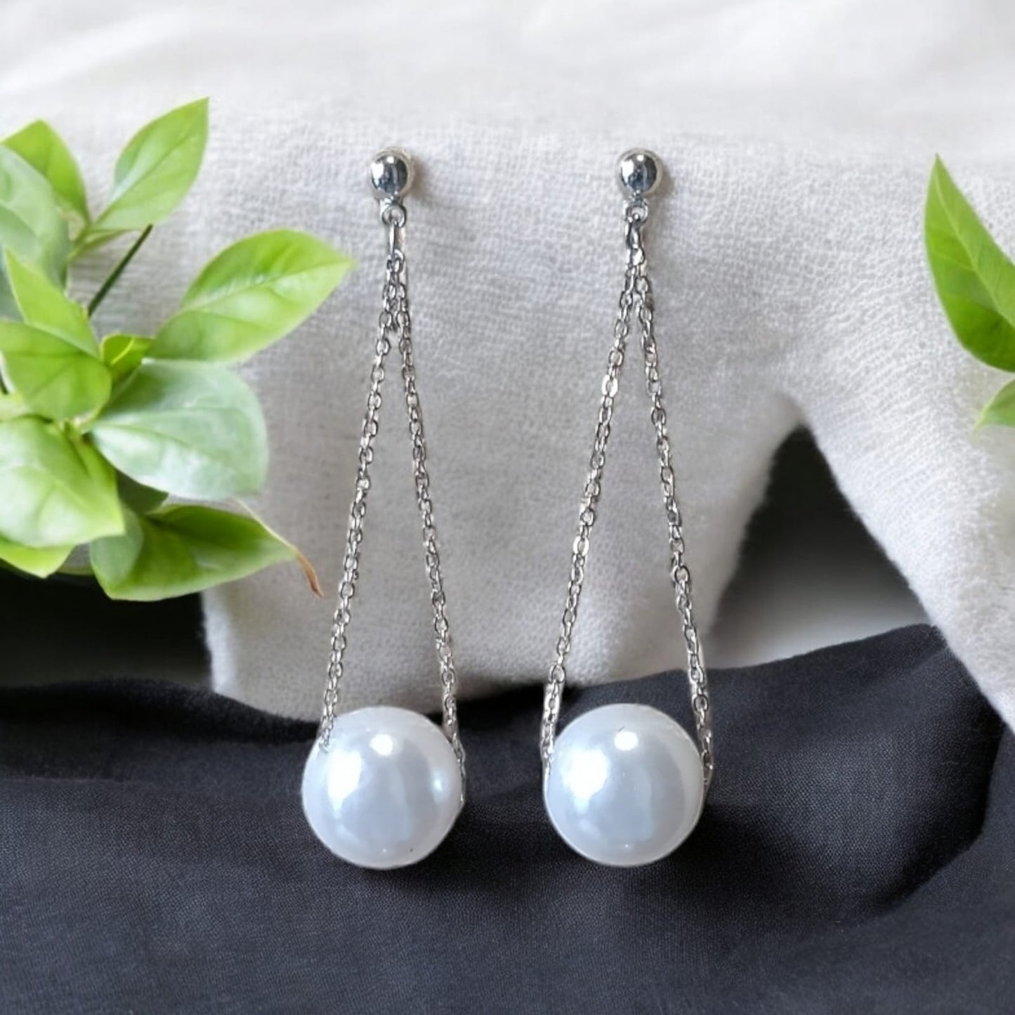 White floating pearl drop earring