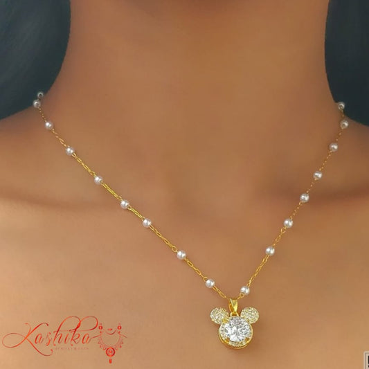 Golden and pearl necklace with mickey mouse's head pendant