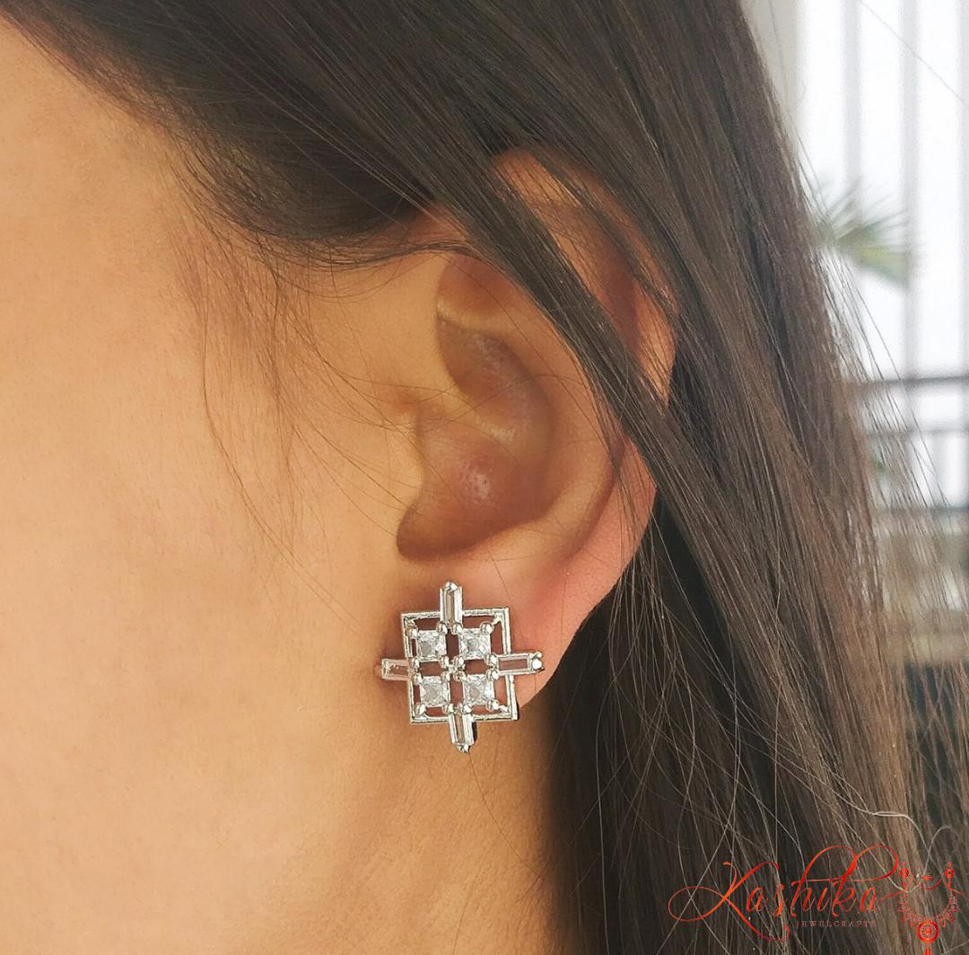 White stone stud earrings