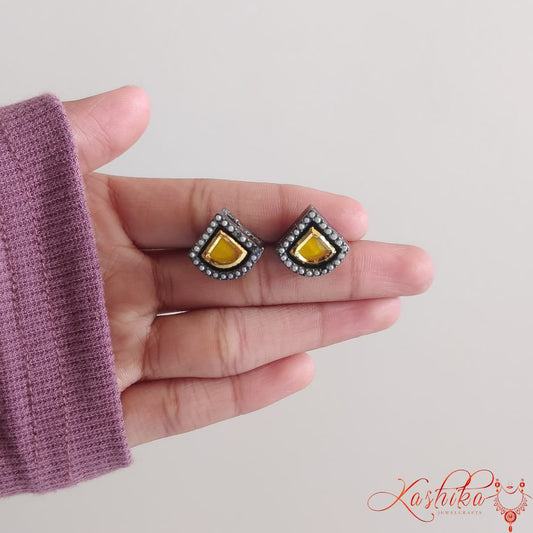 Oxidised stud earrings with teardrop-shaped yellow gemstone with golden and silver detailing