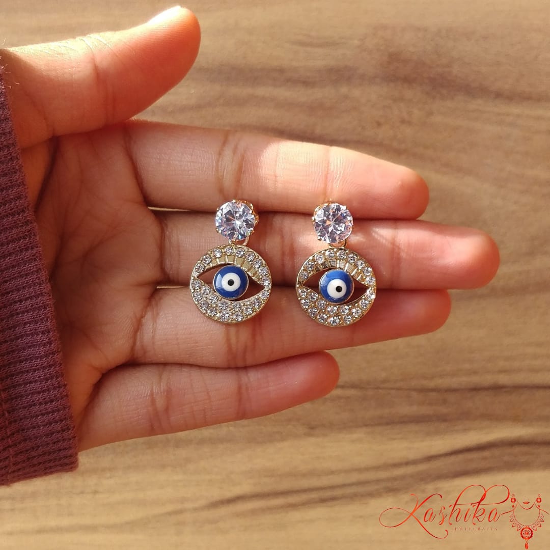 White and golden stone evil eye earrings