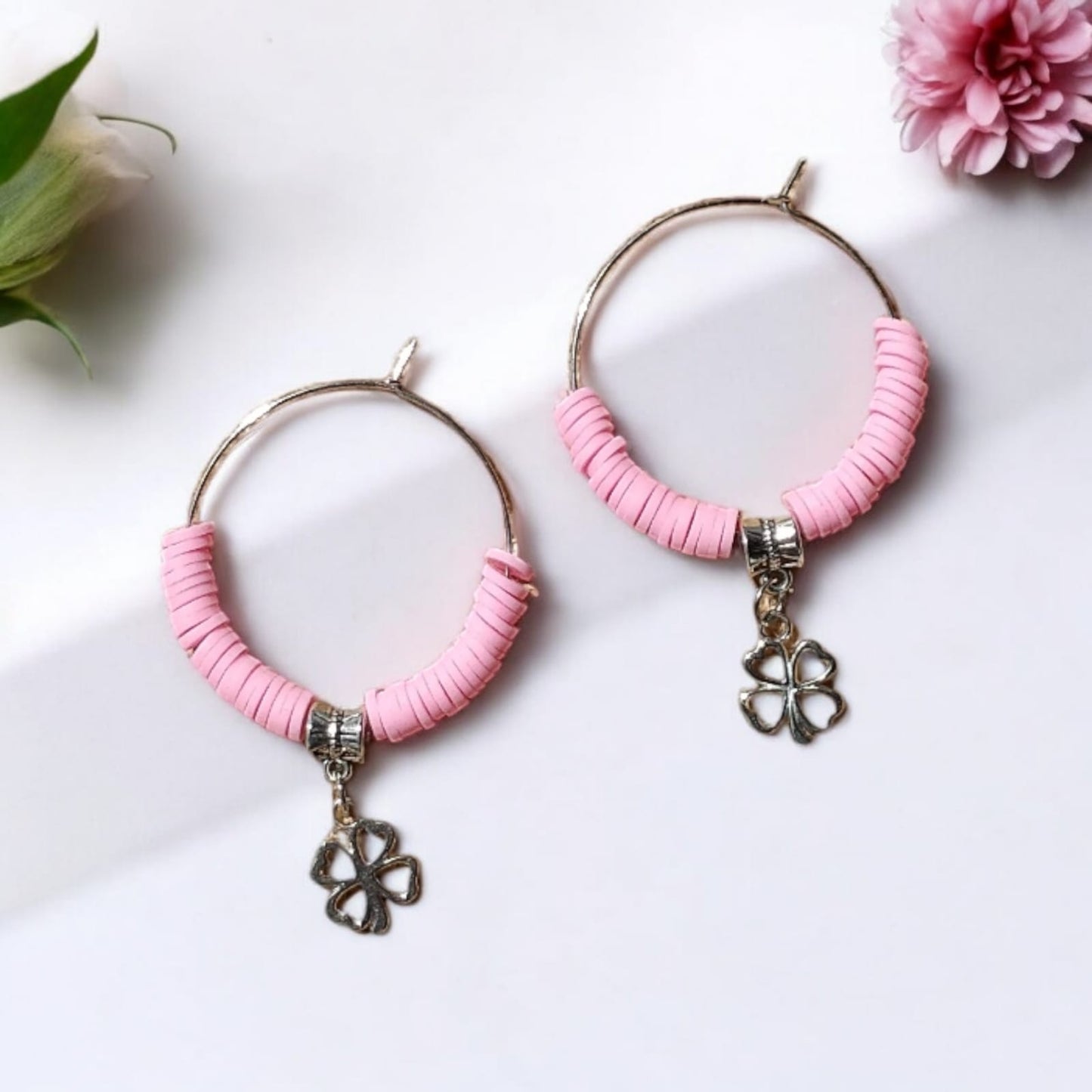 Hoop earrings with pink beads and charm